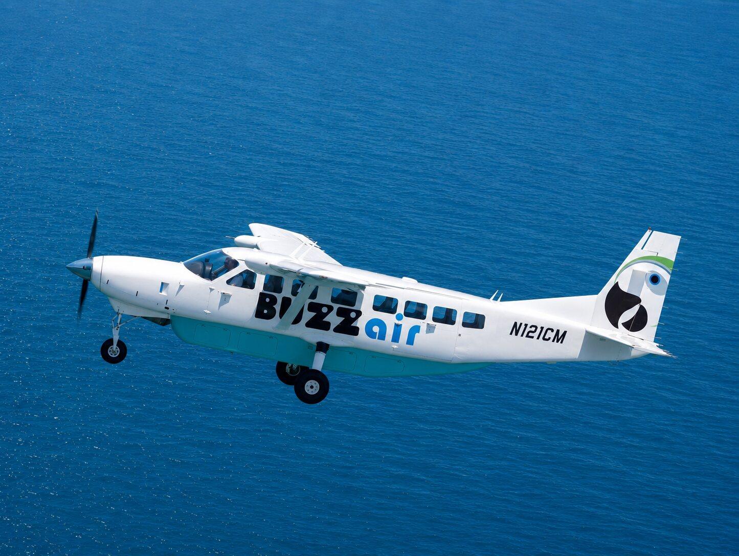 Buzz Air's Cessna Grand Caravan in flight over open water